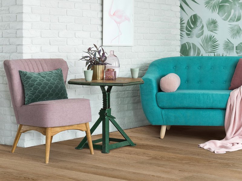 pink armchair and teal couch